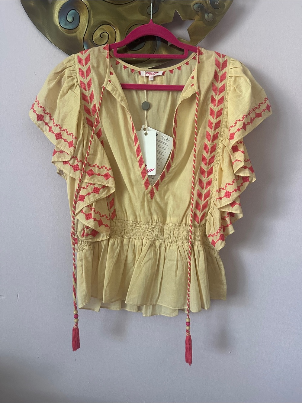 Pin-Up Stars Cream Peplum Blouse with Pink Embroidery and Tassel Ties